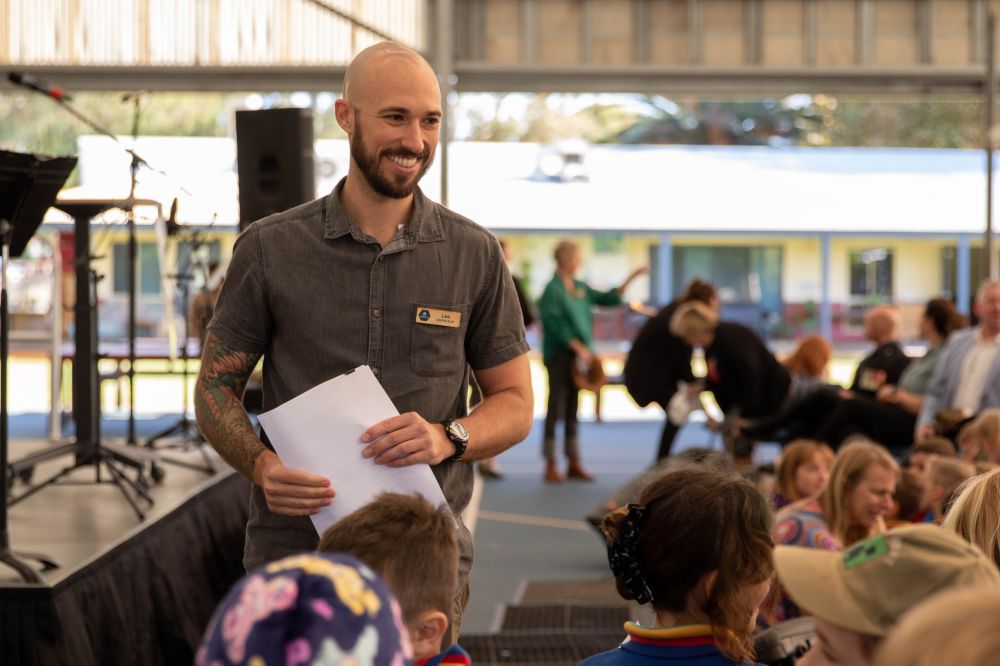 Lee with Primary students.jpg